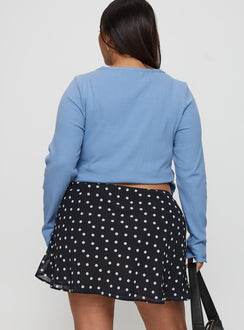 back view of model wearing Princess Polly Dapple Bias Mini Skirt Black Polka Dot Curve Mini Skirts Skirts 