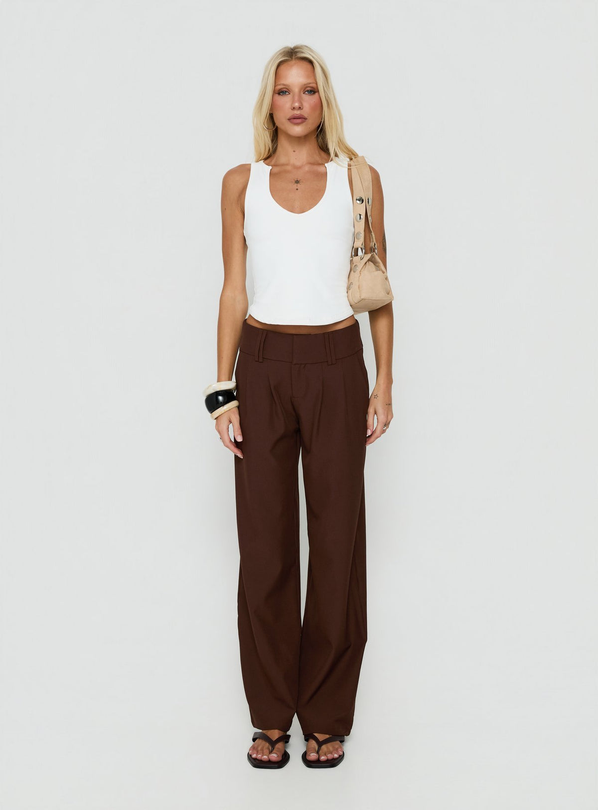 Presenting the Two Lovers Low Rise Pants Chocolate in womens regular pants with belt and wide-leg fit on-body view of model wearing