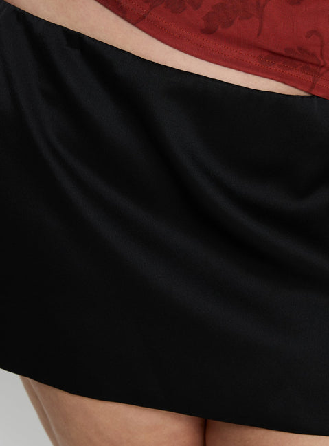 back view of model wearing Princess Polly Nadya Satin Tailored Mini Skirt Black Curve Skirts 