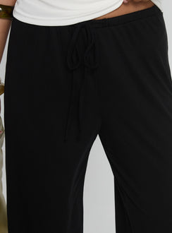 back view of model wearing Princess Polly Gavrielle Jersey Wide Leg Pants Black High Rise Pants Pants 