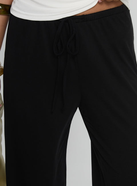 back view of model wearing Princess Polly Gavrielle Jersey Wide Leg Pants Black High Rise Pants Pants 