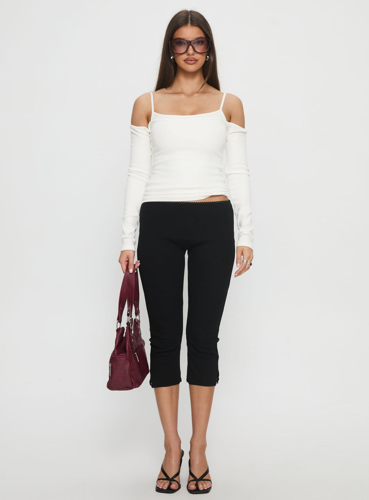 front view of model wearing Princess Polly Baseline Rib Capri Pants Black Tall Mid Rise Pants Pants 