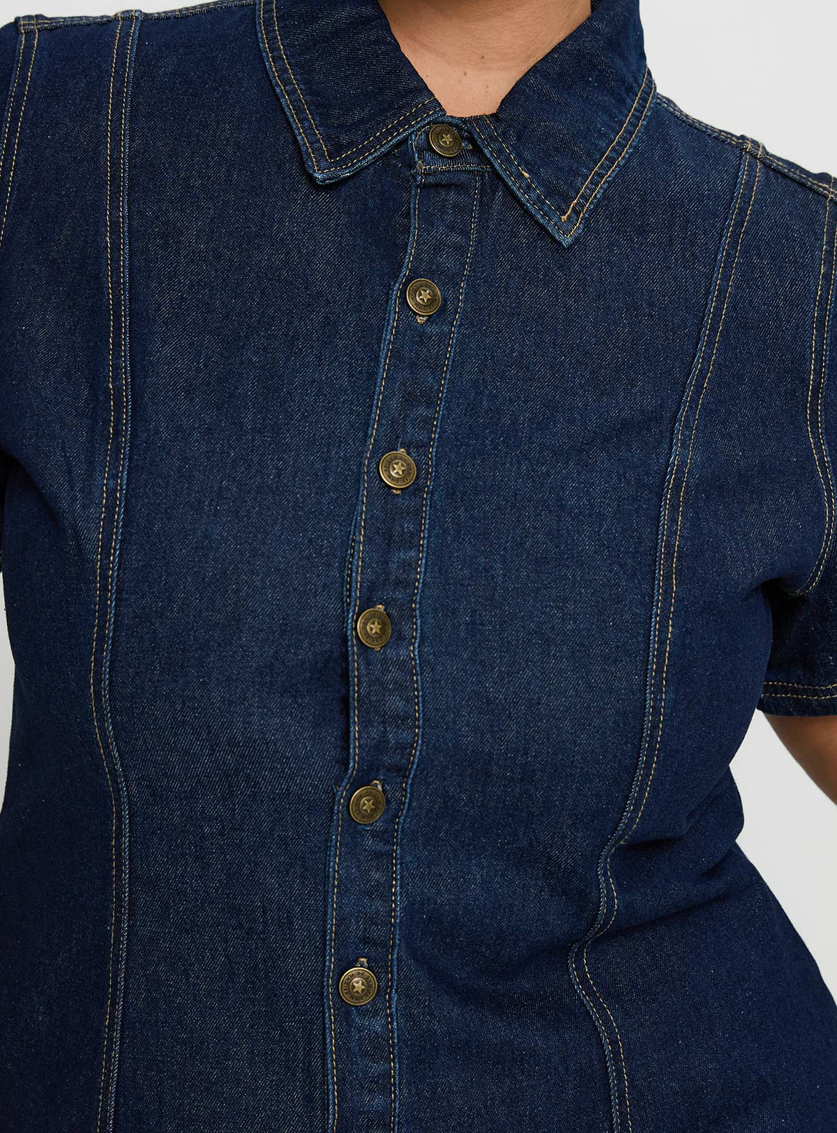 back view of model wearing Princess Polly Perception Denim Mini Dress Mid Wash Curve V-Neck 