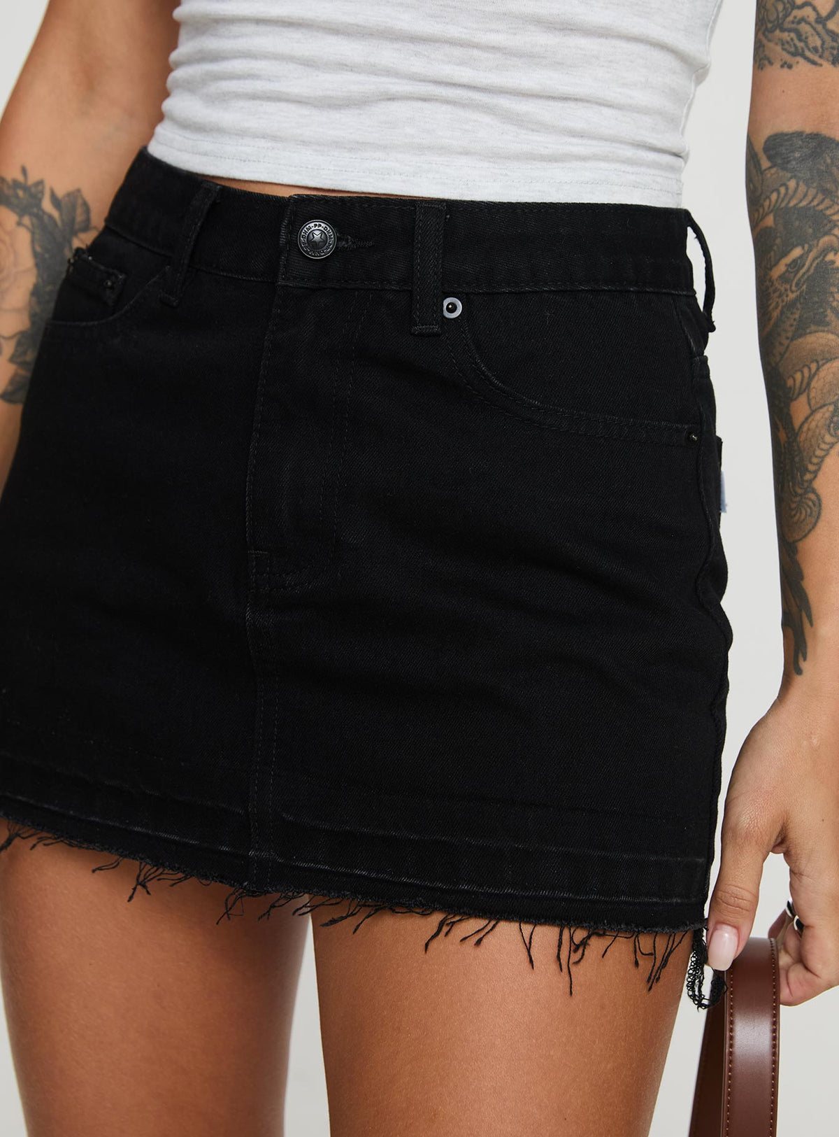 back view of model wearing Princess Polly Aster Mini Skirt Black Mini Skirts Skirts 