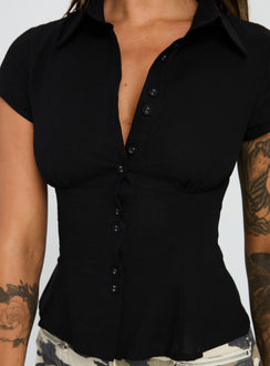 back view of model wearing Princess Polly Cottesloe Blouse Top Textured Black Short Sleeves V-Neck 