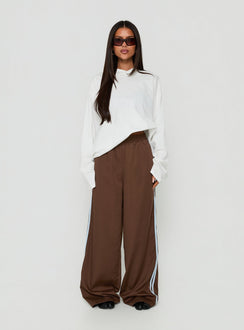 Explore the Fielder Track Pants Brown / Blue womens-regular-pants with high-rise on-body view of model wearing Princess Polly