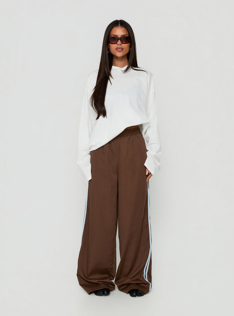 Explore the Fielder Track Pants Brown / Blue womens-regular-pants with high-rise on-body view of model wearing Princess Polly
