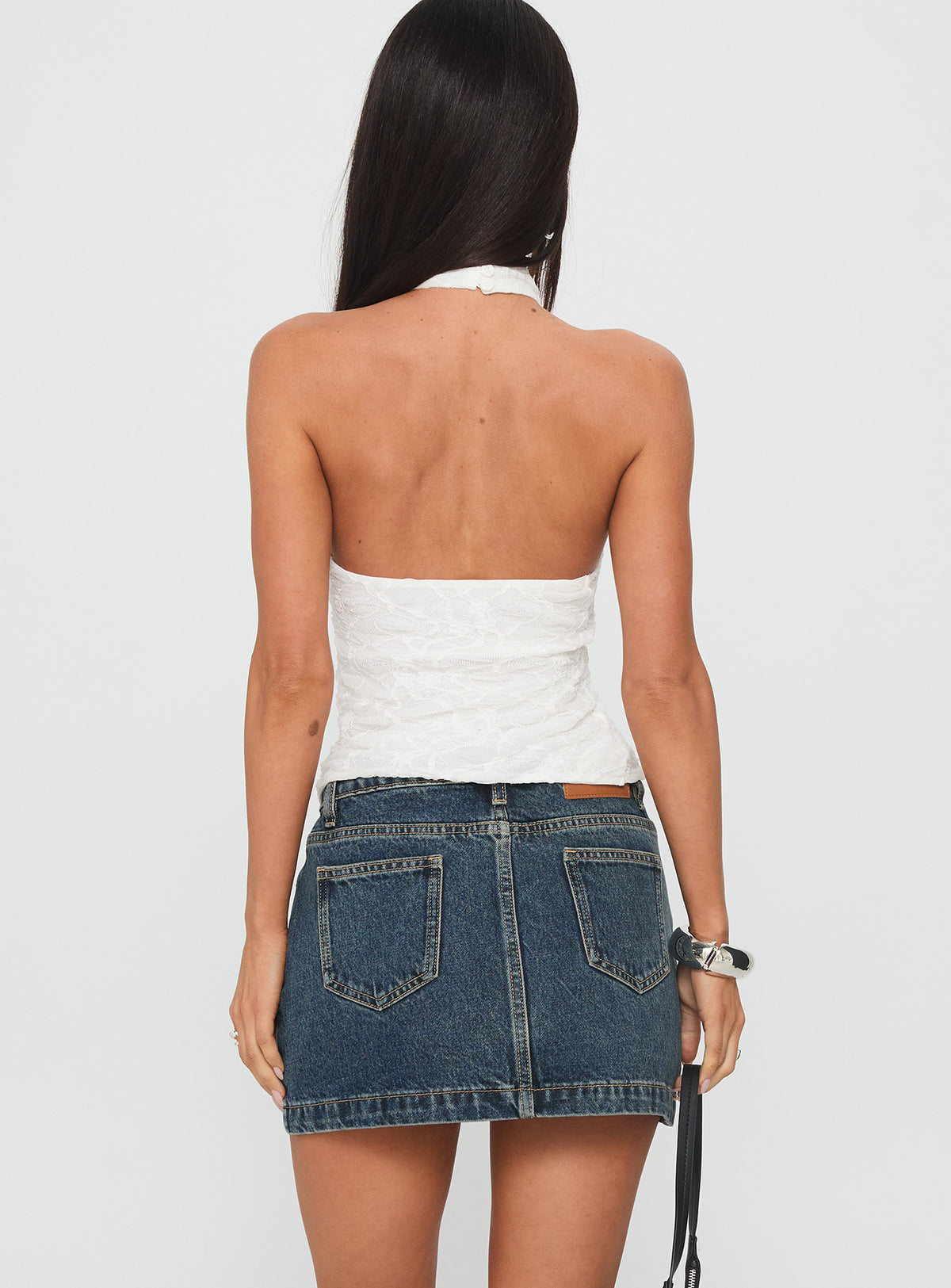 back view of model wearing Princess Polly Nickei Denim Mini Skirt Washed Blue Tall Mini Skirts Skirts 