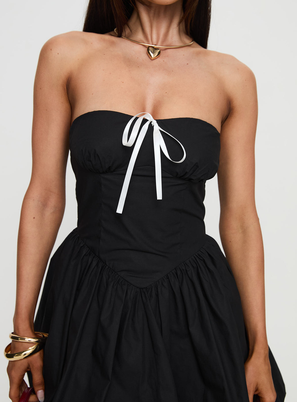 back view of model wearing Princess Polly Melaina Bubble Hem Mini Dress Black Sweetheart Neckline 