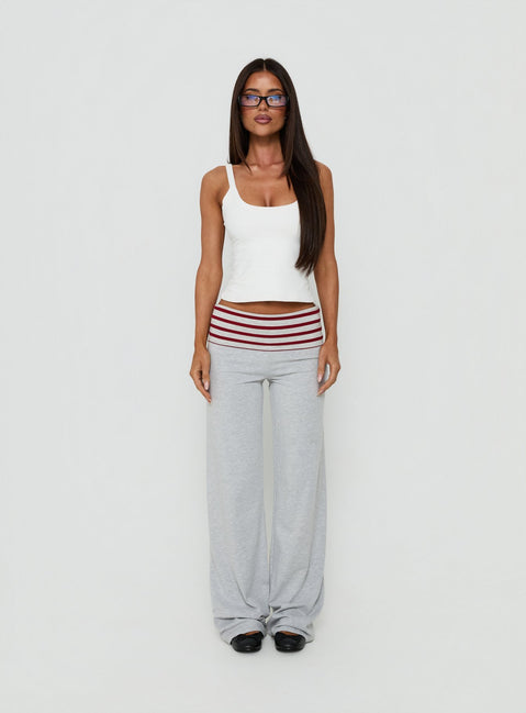 Showcasing Jetset Pants Grey Red Stripe in womens regular pants with mid-rise striped wide-leg styling front view of model wearing Princess Polly