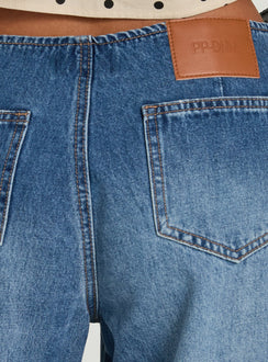 Highlighting the Roamer No Waist Low Rise Super Baggy Vintage Mid Blue womens jeans with low-rise waist and stitching detail Princess Polly