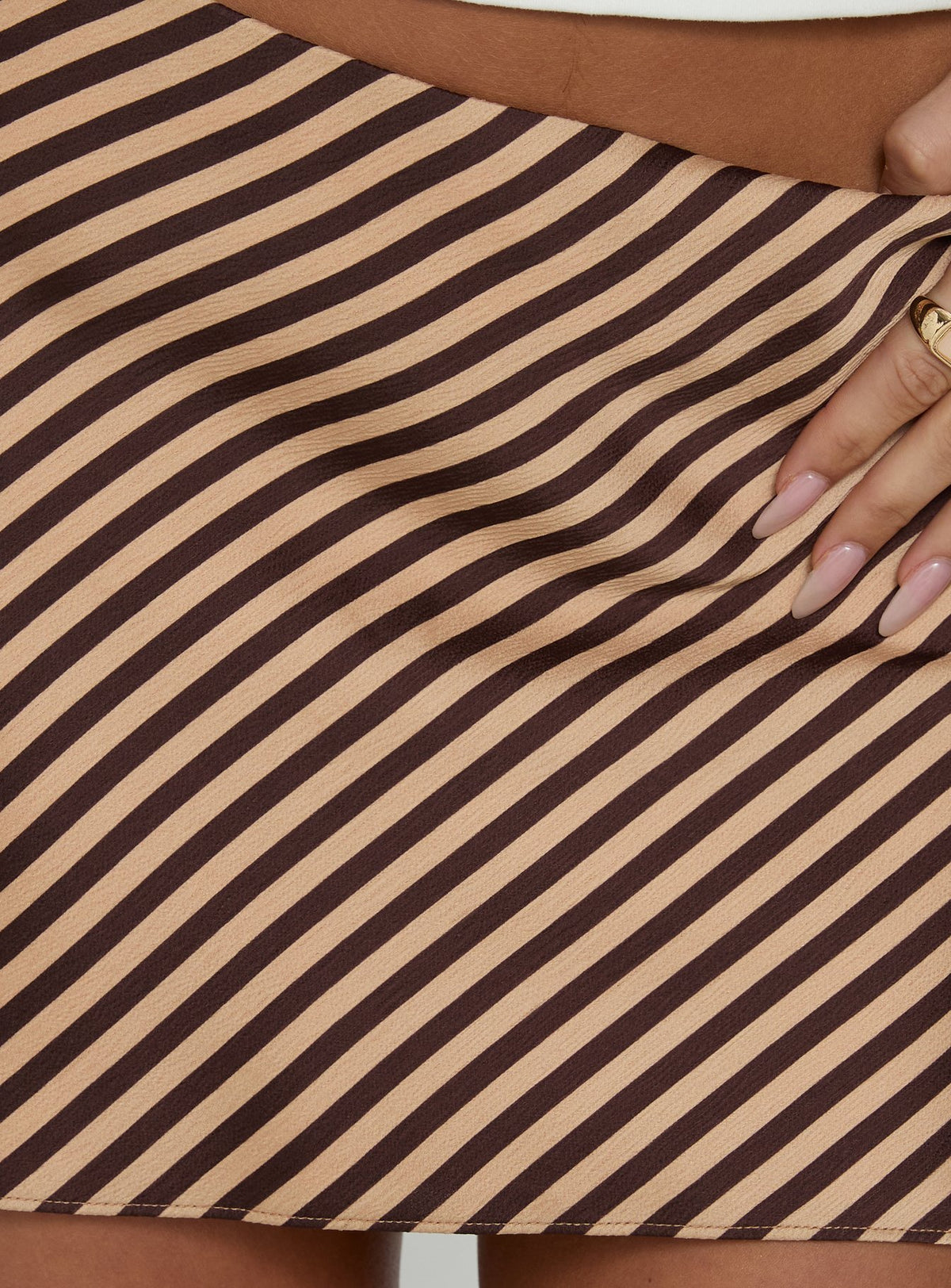 Capturing the Eliena Mini Skirt Multi in womens-skirts with brown and tan striped mini length texture Princess Polly