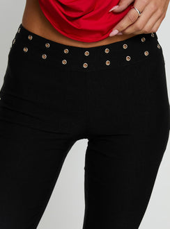 Showcasing the Yevina Eyelet Flare Pant Black Tall womens-regular-pants with high-rise detail view of model wearing Princess Polly