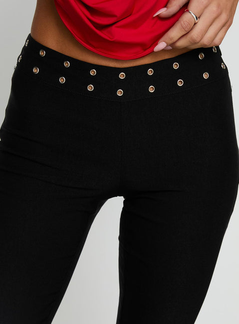 Showcasing the Yevina Eyelet Flare Pant Black Tall womens-regular-pants with high-rise detail view of model wearing Princess Polly