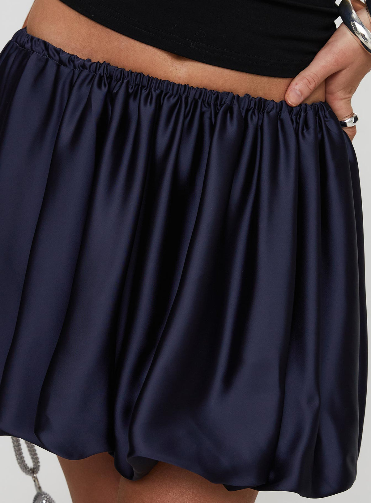 back view of model wearing Princess Polly Rubee Bubble Hem Mini Skirt Navy Mini Skirts Skirts 