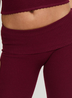 back view of model wearing Princess Polly Closed Eyes Flared Pants Maroon Low Rise Pants Pants 