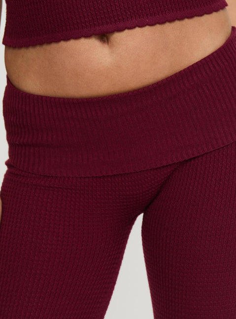 back view of model wearing Princess Polly Closed Eyes Flared Pants Maroon Low Rise Pants Pants 