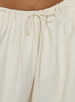 Showcasing the Bungala Oversized Relaxed Pants in Ivory Petite womens-regular-pants with high-rise waist and wide-leg design detail Princess Polly