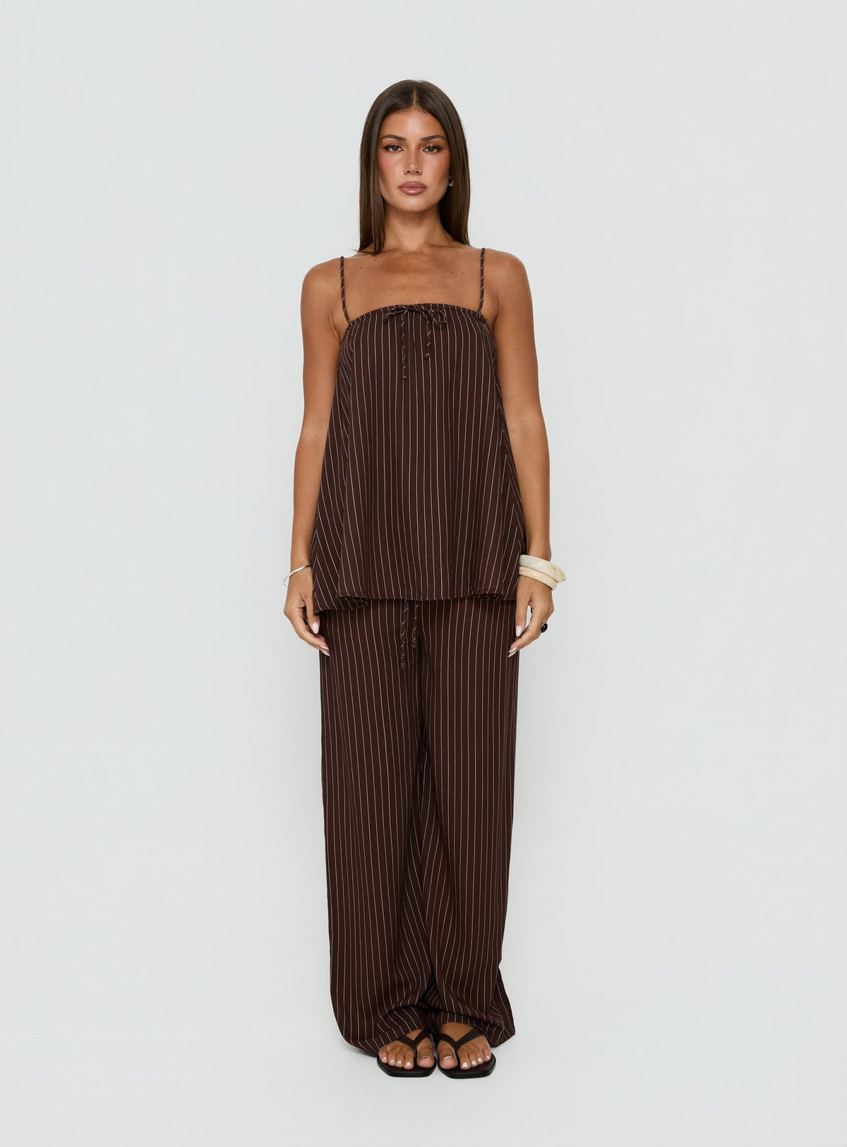 Showcasing Amibella Mid Rise Wide Leg Pants Brown / Cream Stripe womens-regular-pants mid-rise front view of model wearing