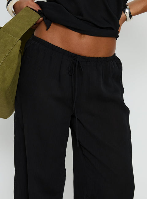 back view of model wearing Princess Polly Emorisa Mid Rise Chiffon Pant Black Mid Rise Pants Pants 