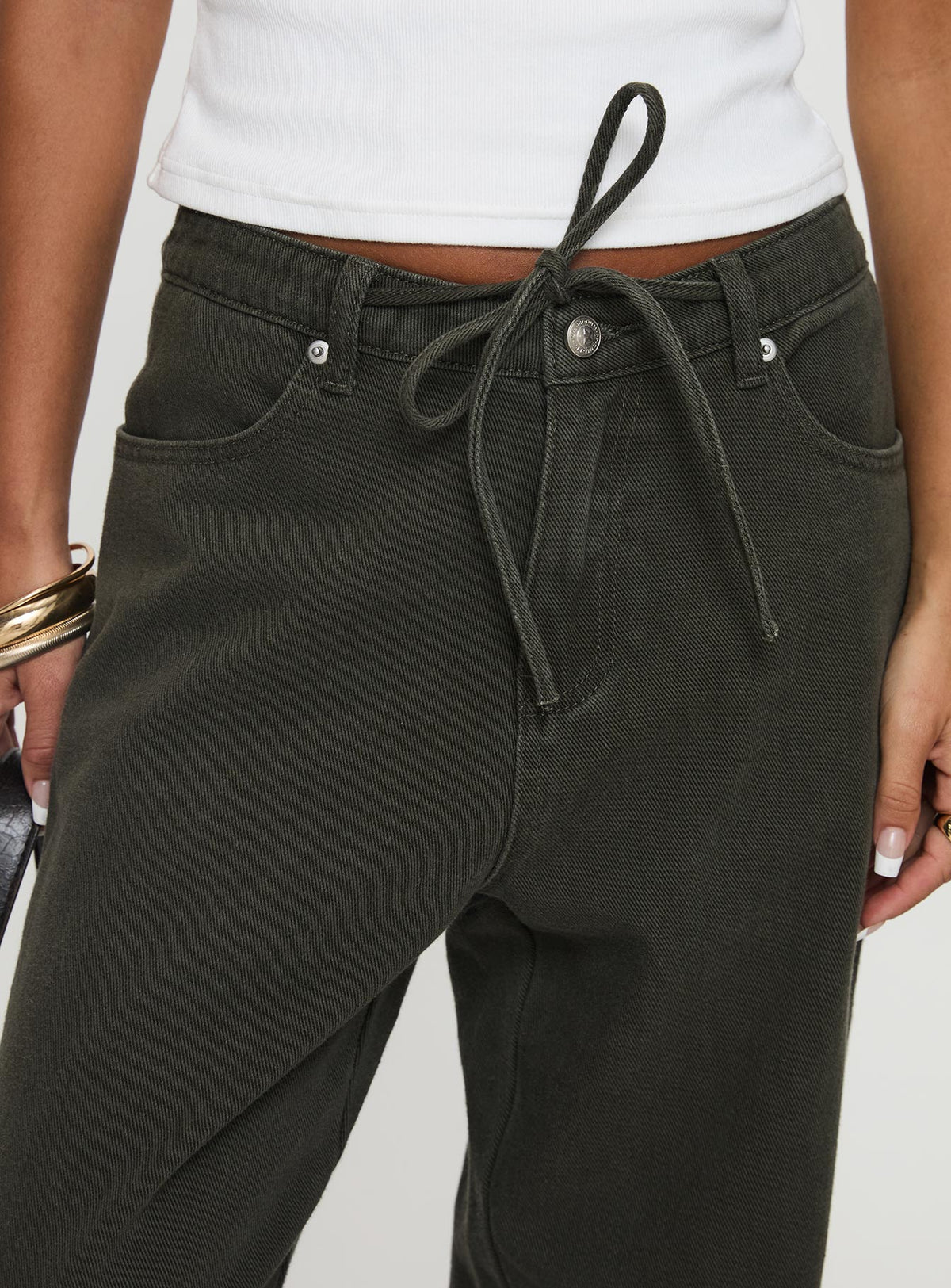 side view of model wearing Princess Polly Bruiser Tie Waist Mid Rise Wide Leg Jeans Green High Rise Jeans Jeans 