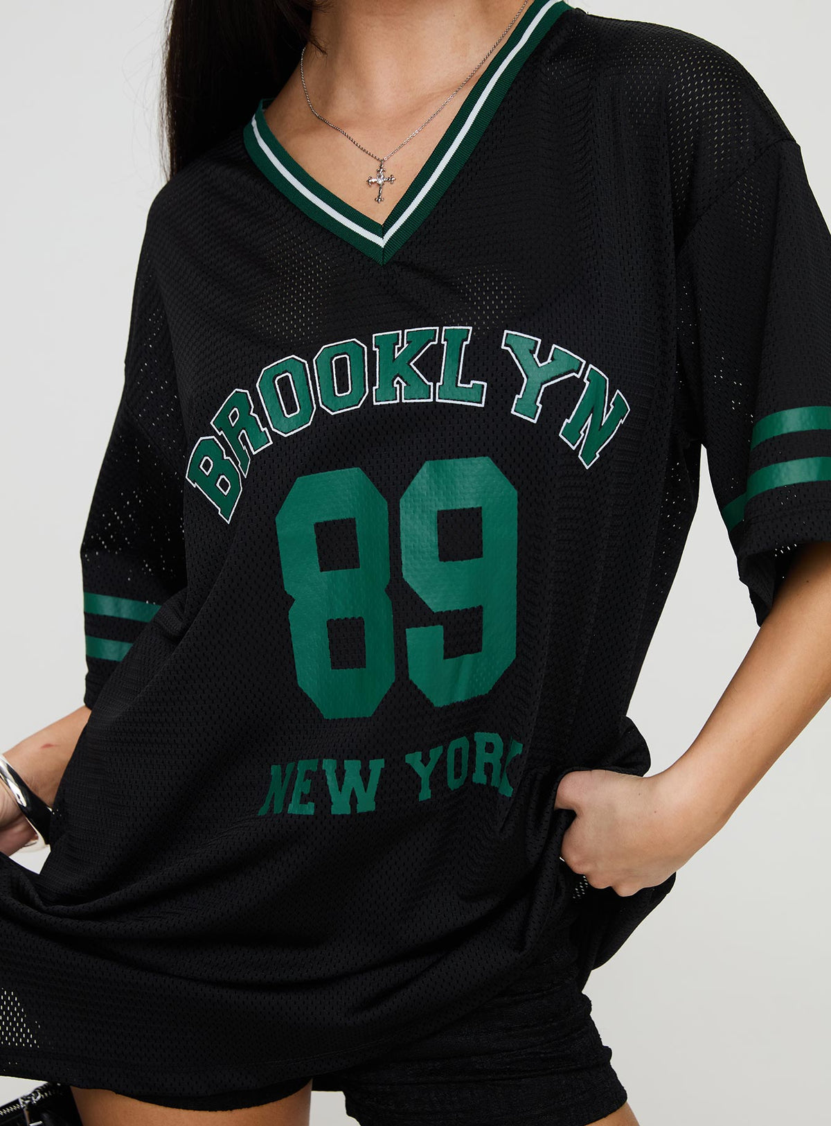 front view of model wearing Princess Polly Michail Jersey Mini Dress Green V-Neck 