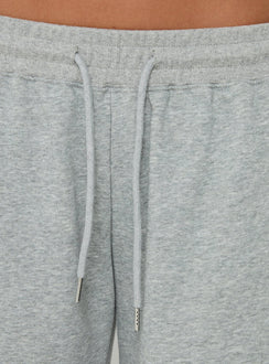 Highlighting the drawstring detail of the Nikko Longline Fleece Shorts Grey Marle in womens regular pants with mid-rise Princess Polly