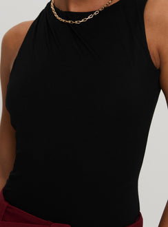 back view of model wearing Princess Polly Centre Stage Cut Out Bodysuit Black Sleeveless Bodysuit 
