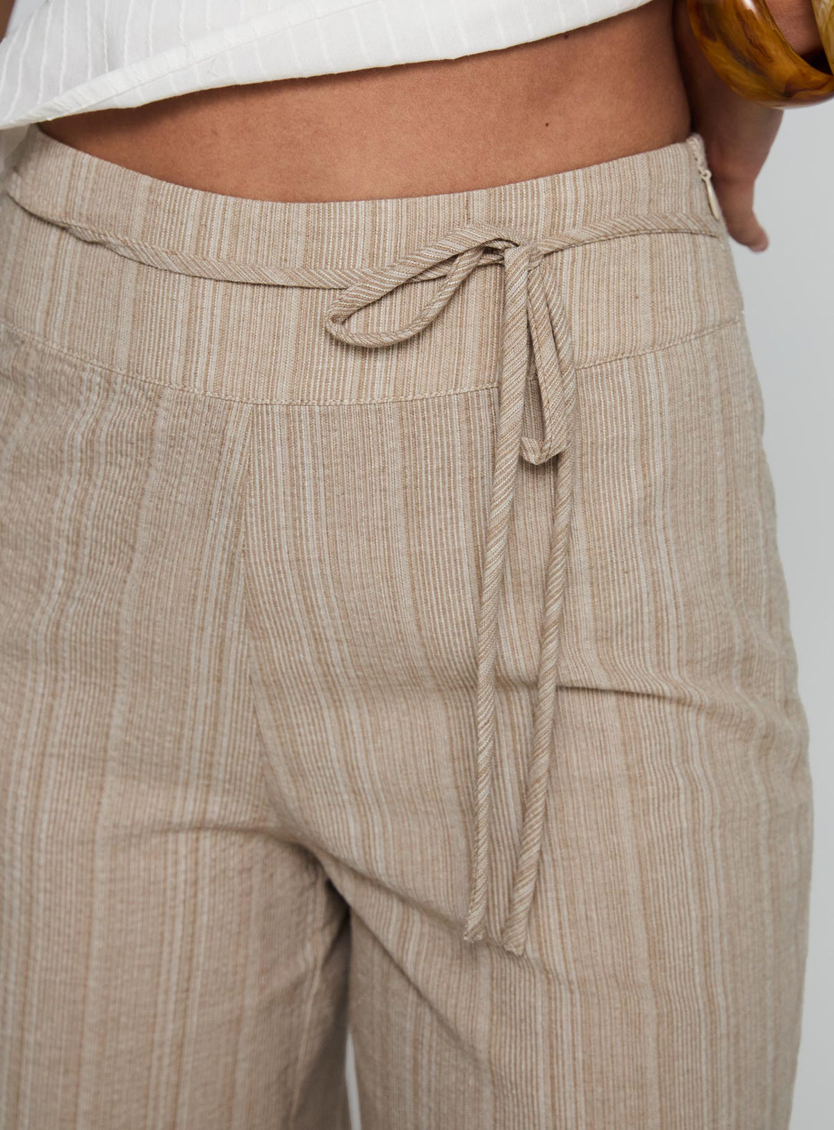 side view of model wearing Princess Polly Rush Hours Tie Up Pants Beige Pants 