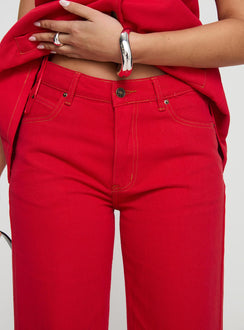 back view of model wearing Princess Polly Top Model Jeans Red Mid Rise Jeans Jeans 