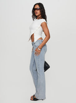 side view of model wearing Princess Polly Bethany Bootleg Low Rise Jeans Light Wash Low Rise Jeans 
