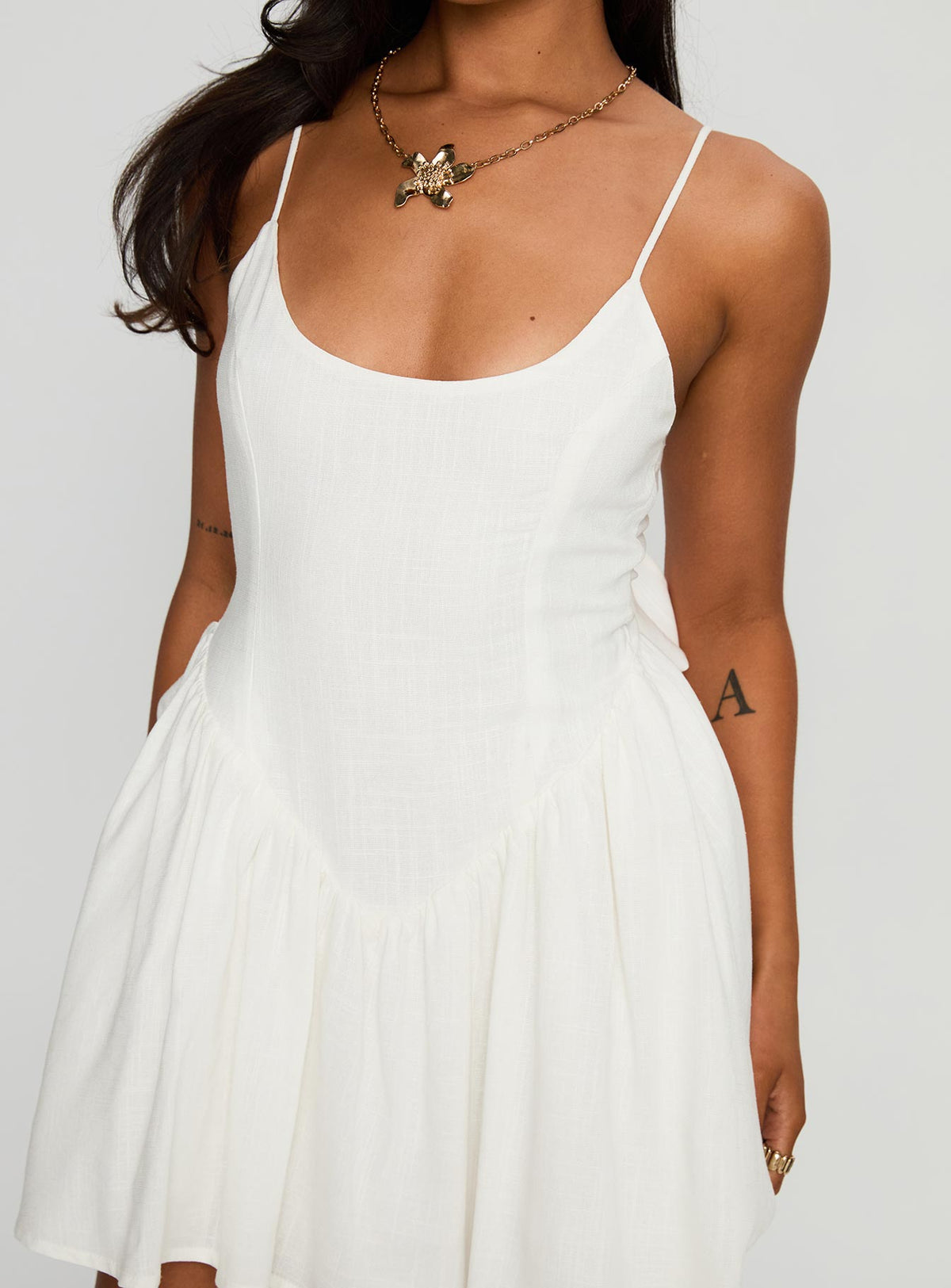 side view of model wearing Princess Polly Angel Wings Tie Up Mini Dress White Scoop Neck 