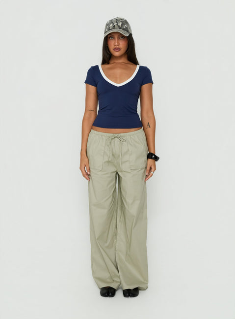 Showcasing the Toren Drawstring Straight Leg Pants Stone womens-regular-pants with mid-rise front view of model wearing Princess Polly