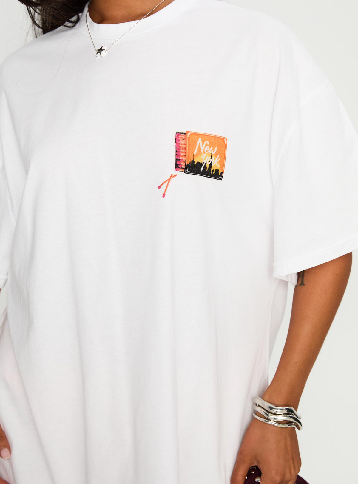 side view of model wearing Princess Polly Matchbox Collection Graphic Top White / Multi Half Sleeves Crew Neck 