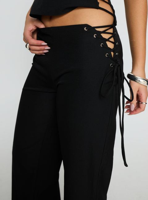 back view of model wearing Princess Polly Riane Lace Up Pants Black Mid Rise Pants Pants 
