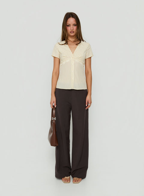 Introducing Mericana Low Rise Wide Leg Pants in Brown womens regular pants with low-rise waist front view of model wearing Princess Polly