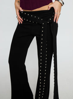 back view of model wearing Princess Polly Nikolia Studded Wrap Belt Pants Black Mid Rise Pants Pants 
