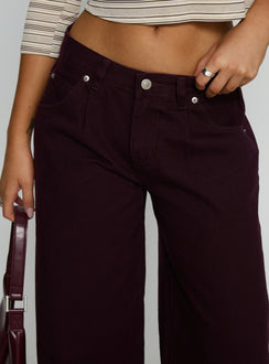 front view of model wearing Princess Polly Supercut Low Rise Baggy Pleat Jeans Currant Mid Rise Jeans Jeans 