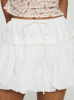   side view of model wearing Princess Polly Dear London Bubble Hem Mini Skirt White Mini Skirts Skirts 