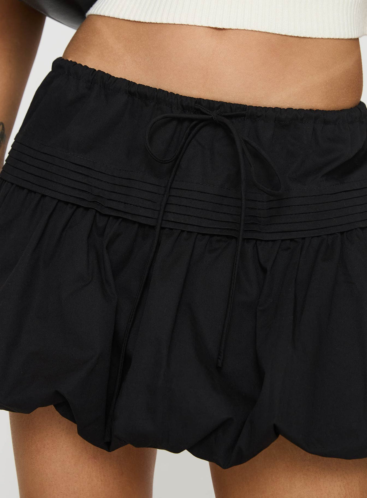 back view of model wearing Princess Polly Dear London Bubble Hem Mini Skirt Black Mini Skirts Skirts 
