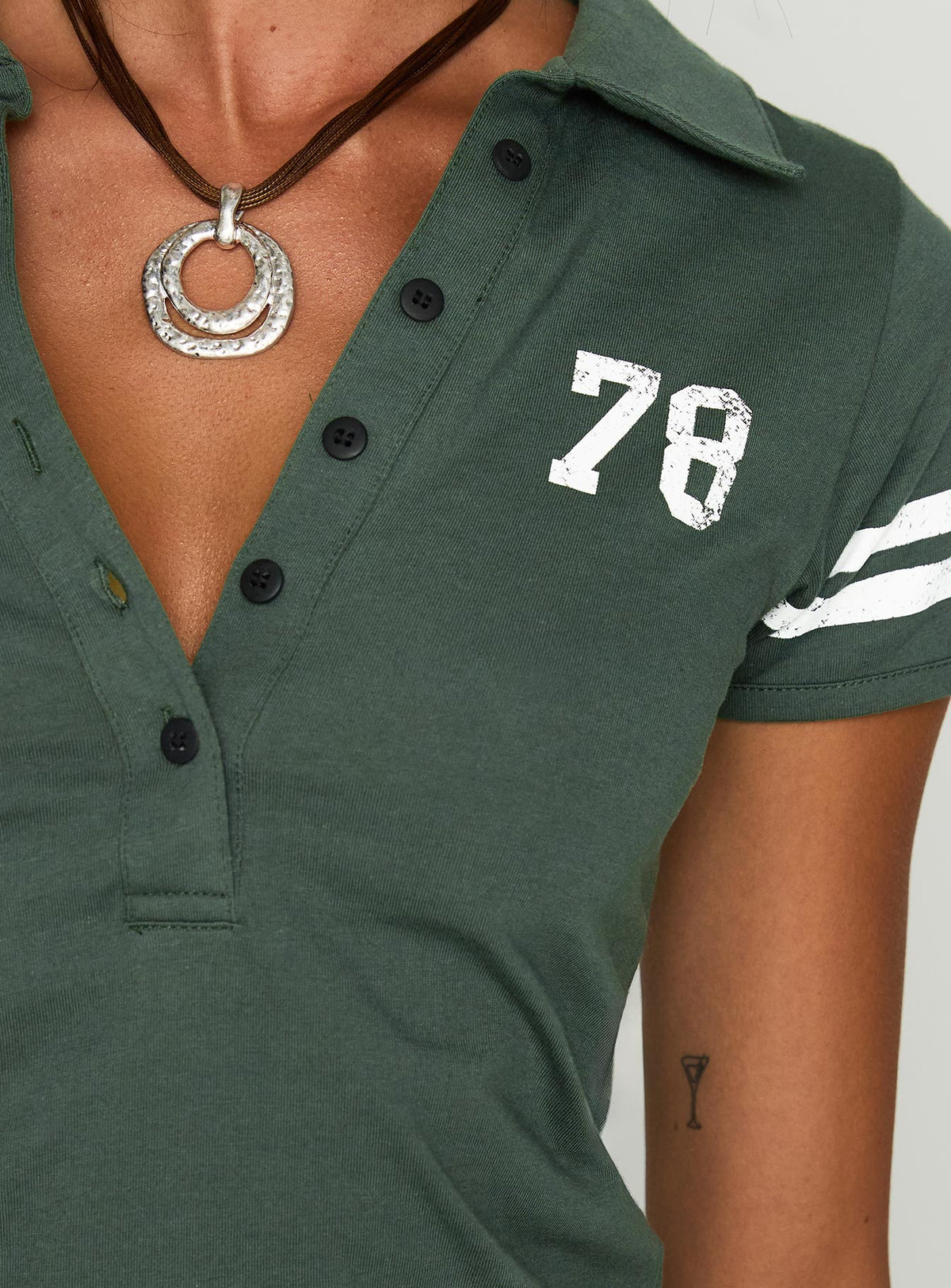 back view of model wearing Princess Polly Polo 78 Top Green Short Sleeves V-Neck 