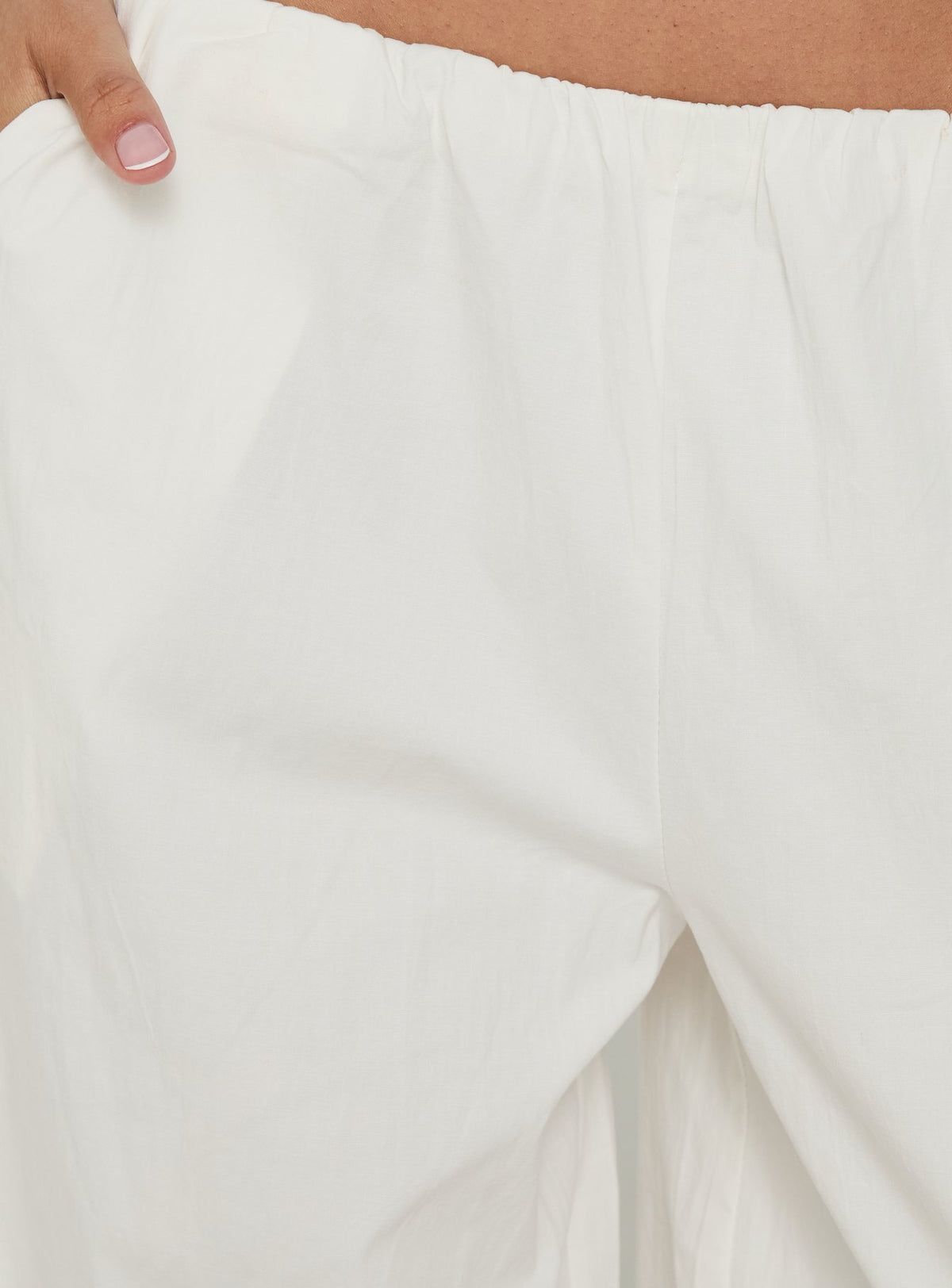 Explore the Lunea Concealed Waistband 3/4 Pant White womens-regular-pants in high-rise detail side view of model wearing Princess Polly