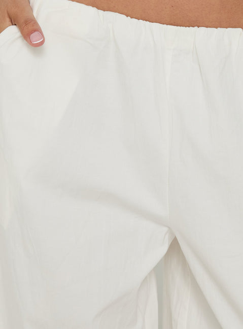 Explore the Lunea Concealed Waistband 3/4 Pant White womens-regular-pants in high-rise detail side view of model wearing Princess Polly