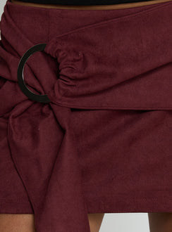   side view of model wearing Princess Polly Lowretta Faux Suede Belt Mini Skirt Burgundy Mini Skirts Skirts 