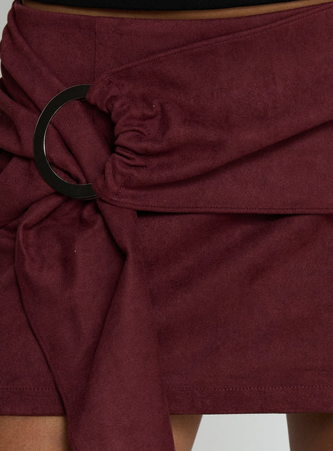   side view of model wearing Princess Polly Lowretta Faux Suede Belt Mini Skirt Burgundy Mini Skirts Skirts 