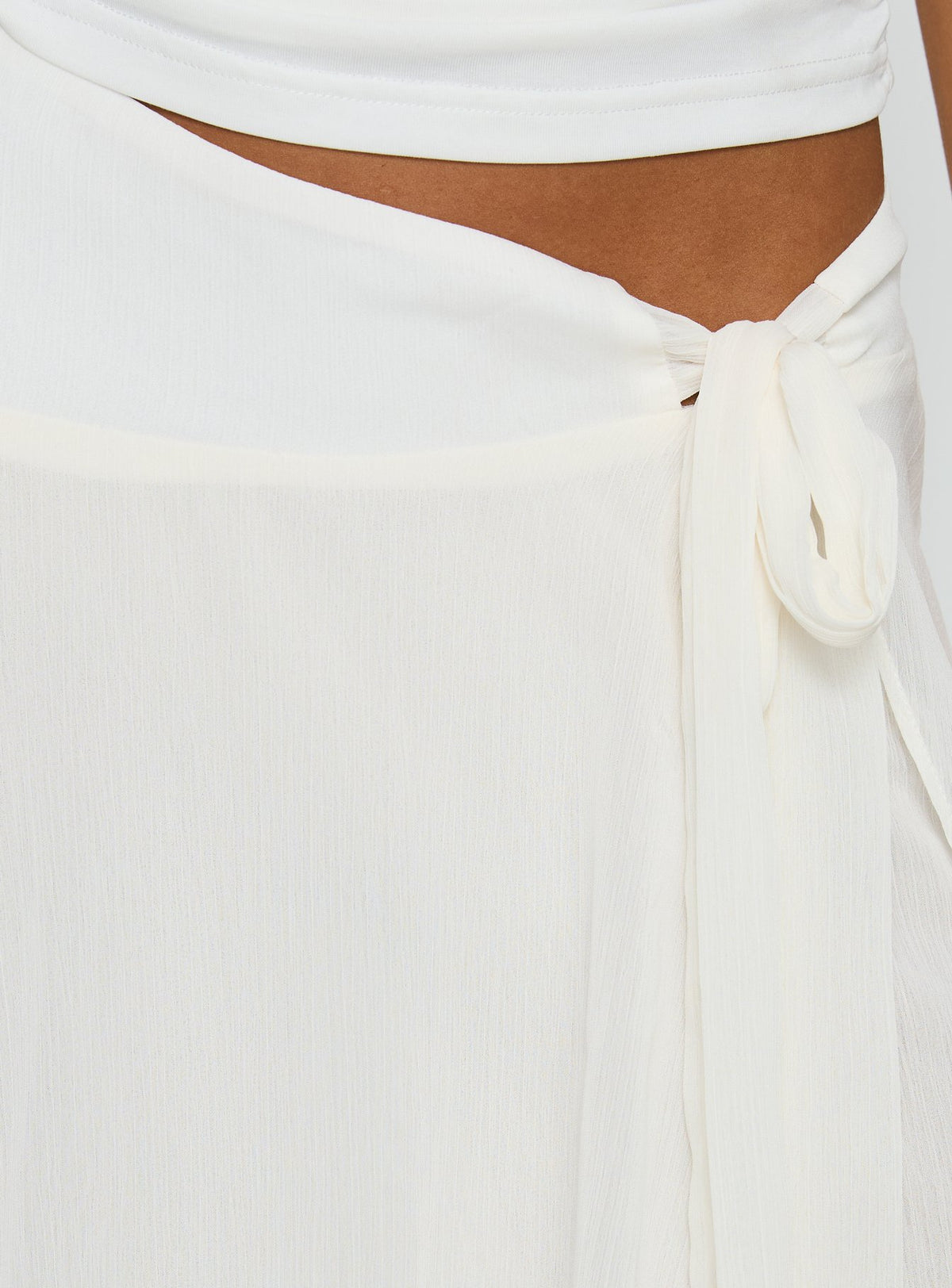 Crafted in ivory, the Ophella Tie Waist Chiffon Midi Skirt Cream womens-skirts with asymmetry and layered details product Princess Polly