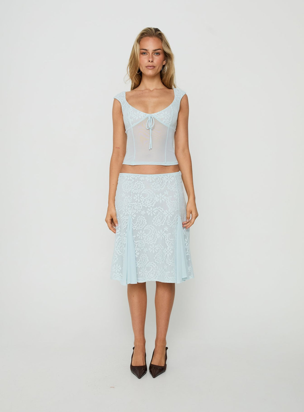 Showcasing the Quani Lace Midi Skirt Blue in womens-skirts with fitted aline silhouette front view of model wearing Princess Polly