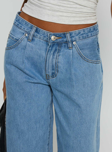 side view of model wearing Princess Polly Supercut Low Rise Baggy Pleat Jeans Light Blue Wash Low Rise Jeans Jeans 