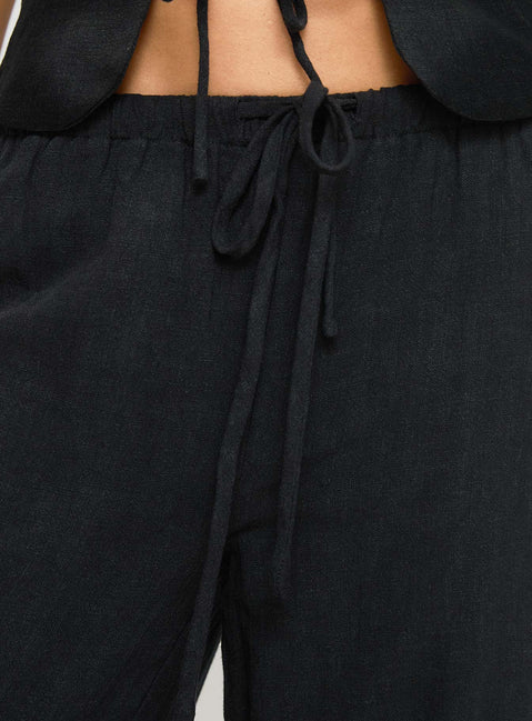 back view of model wearing Princess Polly Felipe Linen Blend Pants Black Pants 