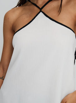 side view of model wearing Princess Polly Rafaella Halter Top Cream Sleeveless Asymmetric Neckline 